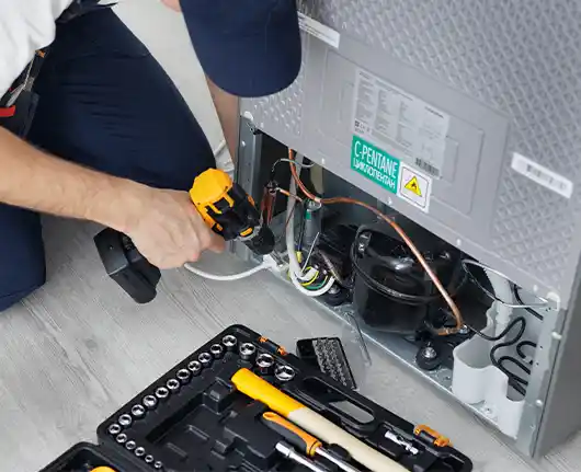 Refrigerator repair Orange County – technician solving common refrigerator problems
